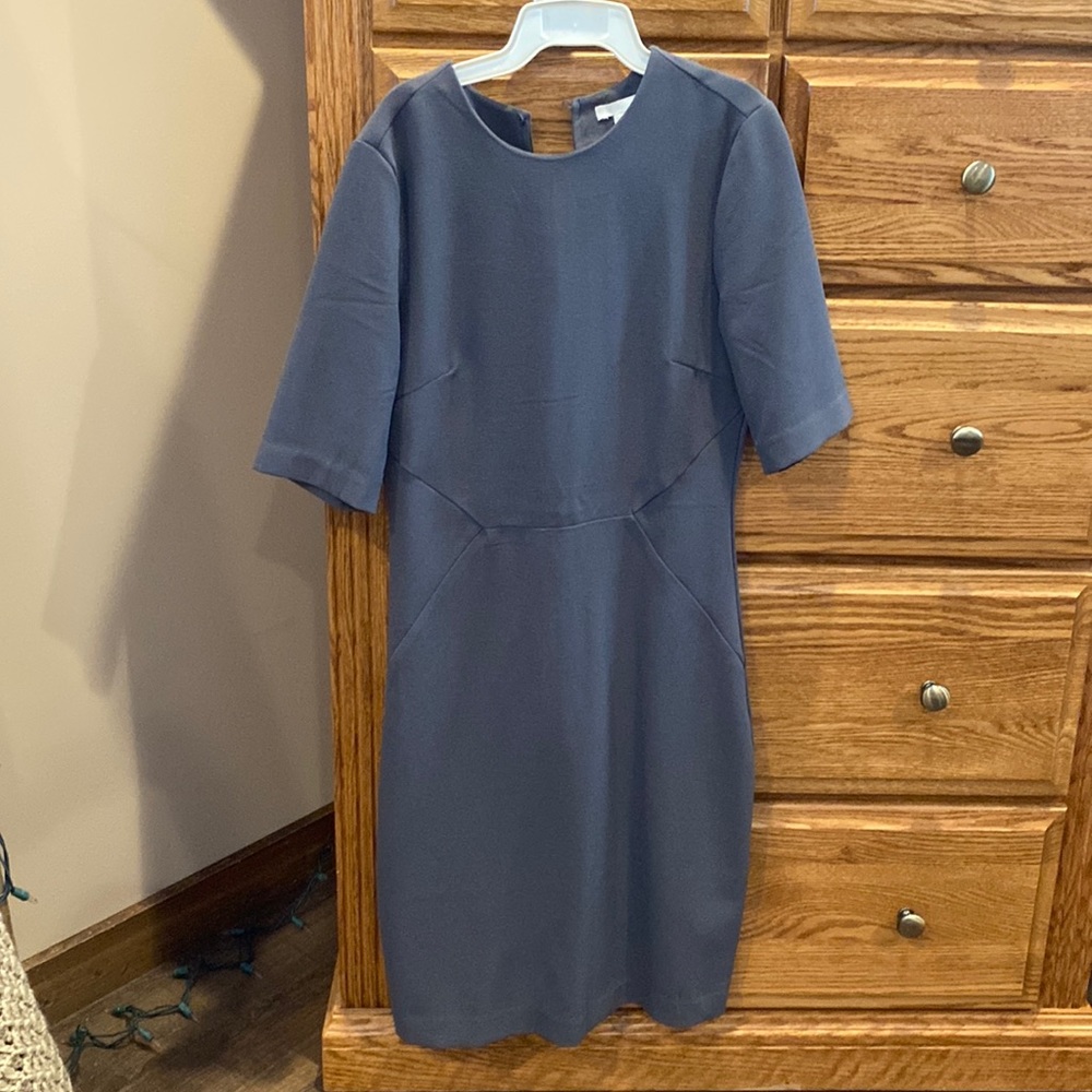 Ladies H&M dress with back hole and fitted, dark gray in color size 6